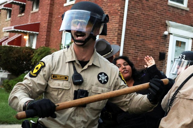Law enforcement officers detain a demonstrator as people take part in a protest near the U.S. Immigration and Customs Enforcement Broadview facility in Chicago, on October 11, 2025. (Photo by Jeenah Moon/Reuters)