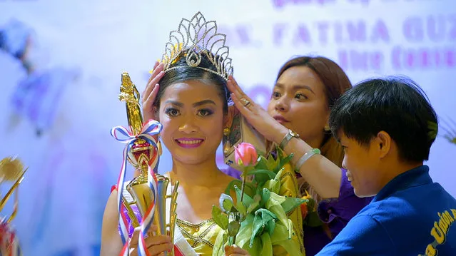 Filipina domestic helper Cyril Goliava (C) is seen in the documentary “Sunday Beauty Queen” film during an annual beauty peageant in Hongkong  in this undated handout image. (Photo by Reuters/Voyage Studios)