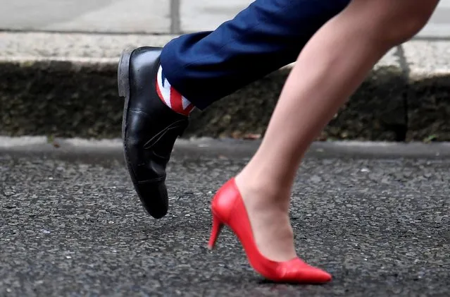 Britain's Health and Social Care Secretary Matt Hancock wears Union Jack socks as he leaves with Britain's Leader of the House of Lords Baroness Evans after a cabinet meeting on Downing Street in London, Britain on January 7, 2020. (Photo by Toby Melville/Reuters)