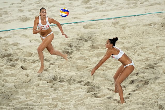 Switzerland's Zoe Verge-Depre, right, sets up a shot for Esmee Boebner in a beach volleyball match against Canada at the 2024 Summer Olympics, Wednesday, July 31, 2024, in Paris, France. (Photo by Robert F. Bukat/AP Photoy)