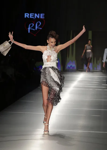 A model walks down the runway wearing clothing designed by Rene Ruiz during Miami Fashion Week, Thursday, May 31, 2018, in Miami. (Photo by Lynne Sladky/AP Photo)