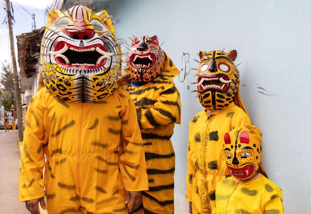 People in tiger costumes wait for the start of a parade during the Tigrada Festival in Chilapa, Guerrero state, Mexico on August 15, 2024. The traditional Tigrada Festival is celebrated on August 15 every year to pray for rainfall to help the townspeople crops. (Photo by Franyeli Garcia/AFP Photo)