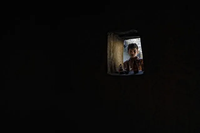 “Black magic”. From the inside of the bothie in a village. Location: India. (Photo and caption by Guido Sperzaga/National Geographic Traveler Photo Contest)