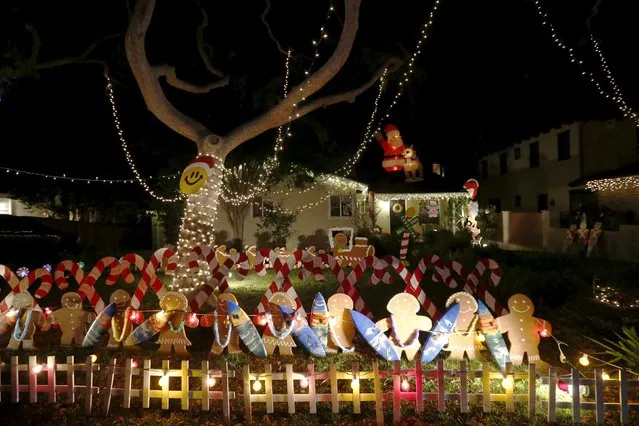 Christmas lights are seen on a home in the Sleepy Hollow area of Torrance, California, United States, December 15, 2015. (Photo by Lucy Nicholson/Reuters)
