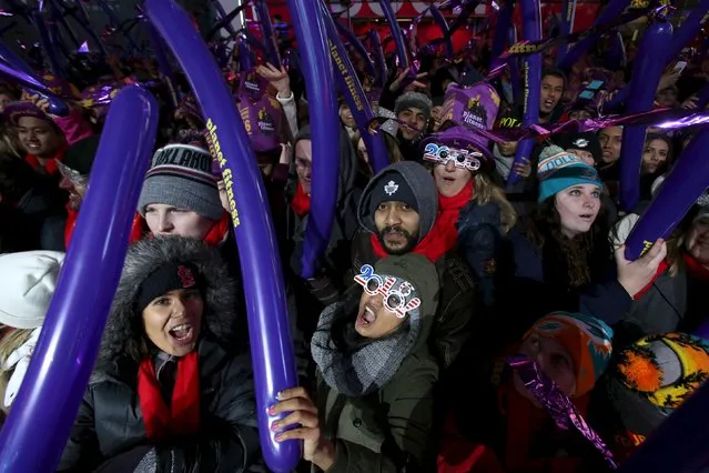 Revelers gather during New Year celebrations in Times Square in the Manhattan borough of New York December 31, 2015. (Photo by Andrew Kelly/Reuters)