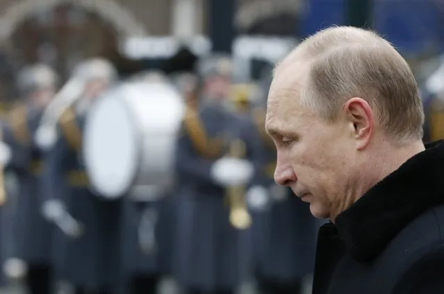 Russian President Vladimir Putin attends a wreath-laying ceremony to mark the Defender of the Fatherland Day at the Tomb of the Unknown Soldier by the Kremlin walls in central Moscow February 23, 2015. (Photo by Sergei Karpukhin/Reuters)