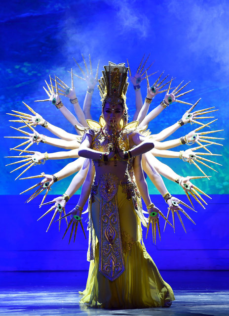 Dancers perform the part of the bodhisattva Avalokiteśvara during a show in Gansu province, China on January 21, 2016. (Photo by Fan Peishen/Xinhua Press/Corbis)