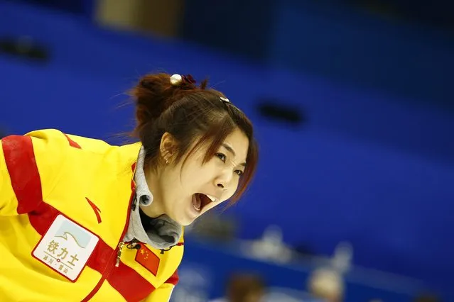 China's skip Sijia Liu instructs her team mates after delivering a stone during their curling round robin game against Canada during the World Women's Curling Championships in Sapporo March 16, 2015. (Photo by Thomas Peter/Reuters)