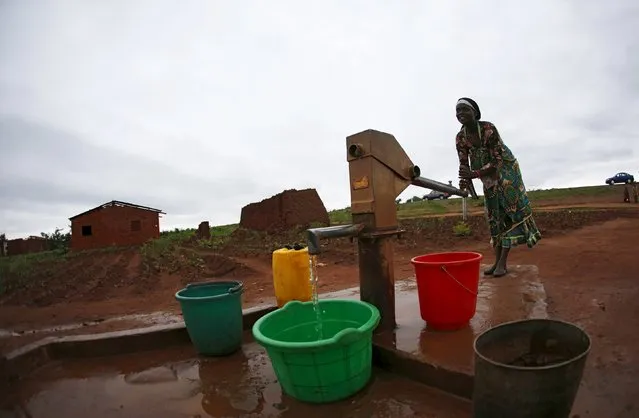 A woman pumps water from a borehole near Malawi's capital Lilongwe, February 2, 2016. (Photo by Mike Hutchings/Reuters)