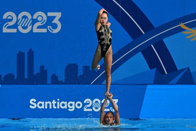 United States competes in the artistic swimming teams technical routine event of the Pan American Games Santiago 2023, at the Aquatics Centre in the National Stadium Sports Park, in Santiago, on October 31, 2023. (Photo by Pablo Vera/AFP Photo)