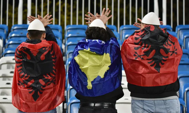 Kosovo and Albania fans pose inside the stadium before the match of Kosovo against Israel at Fadil Vokrri Stadium in Pristina on November 12, 2023. (Photo by Laura Hasani/Reuters)