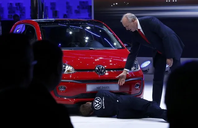 Juergen Stackmann, member of the board of Volkswagen Brand, speaks to a protester during a presentation of Volkswagen up! beats at the 86th International Motor Show in Geneva, Switzerland, March 1, 2016. (Photo by Denis Balibouse/Reuters)