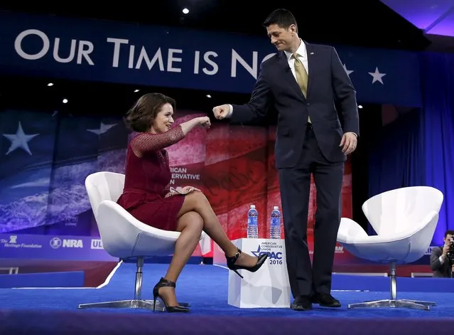 U.S. Speaker of the House Paul Ryan (R-WI) (R) fist bumps moderator Carrie Sheffield at the American Conservative Union (CPAC) 2016 annual conference in Maryland, March 3, 2016. (Photo by Gary Cameron/Reuters)