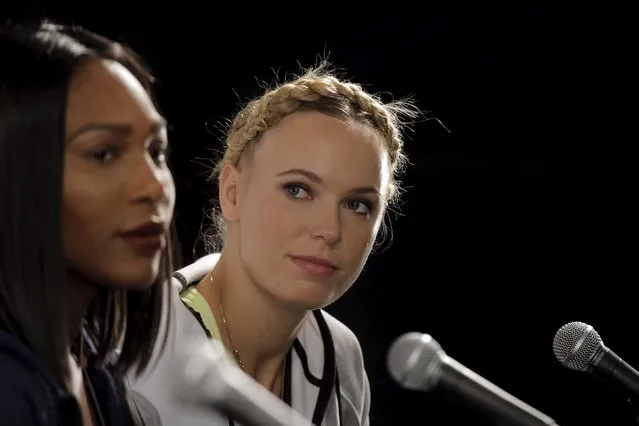 Top ranked women's tennis stars Serena Williams (L) and Caroline Wozniacki attend a news conference in New York March 8, 2016. (Photo by Brendan McDermid/Reuters)