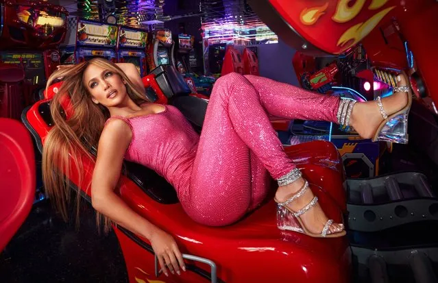 American singer, actress, and dancer Jennifer Lynn Lopez, also known by her nickname J.Lo, 52, reclined on a gaming chair wearing a pink sparkly catsuit and silver wedges during the photoshoot in the second half of September 2021. (Photo by Greg Swales)