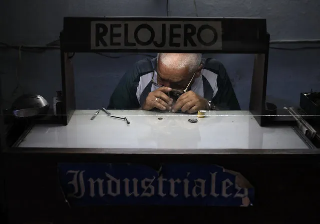 A private watchmaker works at a workshop in Havana, Cuba March 18, 2016. (Photo by Enrique De La Osa/Reuters)