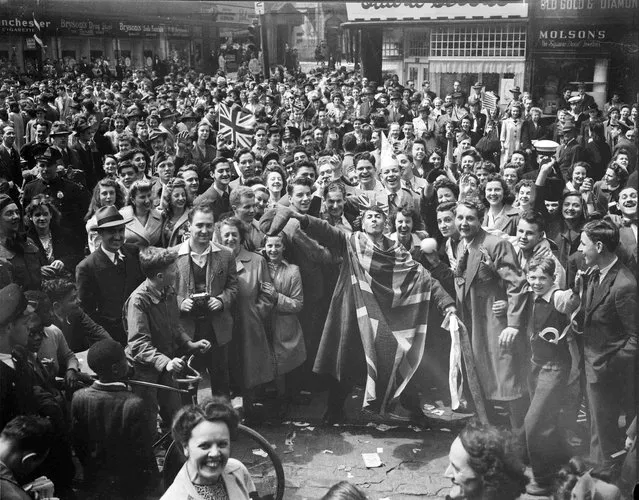 A crowd celebrates VE-Day in Montreal, Quebec, May 8, 1945, in this handout photo provided by Library and Archives Canada. (Photo by Reuters/Montreal Star/Library and Archives Canada)