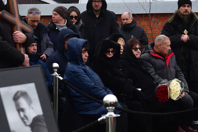 Lyudmila Navalnaya (3rd R front) and Anatoly Navalny (2nd R front), parents of late Russian opposition leader Alexei Navalny, attends a funeral ceremony for their son at the Borisovo cemetery in Moscow's district of Maryino on March 1, 2024. (Photo by Olga Maltseva/AFP Photo)