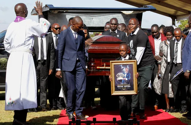 Pallbearers carry the coffin of Kenya's marathon world record holder Kelvin Kiptum, who died in a road accident, during his funeral service at Chepkorio show ground, Elgeyo Marakwet County, Kenya on February 23, 2024. (Photo by Monicah Mwangi/Reuters)