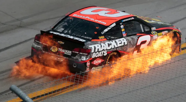 Austin Dillon's car catches fire during the Talladega 500 NASCAR Sprint Cup Series auto race at Talladega Superspeedway, Sunday, May 3, 2015, in Talladega, Ala. (Photo by Butch Dill/AP Photo)