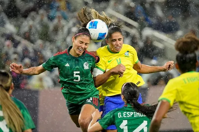 Mexico's Karen Luna (5) and Brazil's Rafaelle (4) battle for a header off a corner kick during the second half of a CONCACAF Gold Cup women's soccer tournament semifinal match, Wednesday, March 6, 2024, in San Diego. (Photo by Gregory Bull/AP Photo)