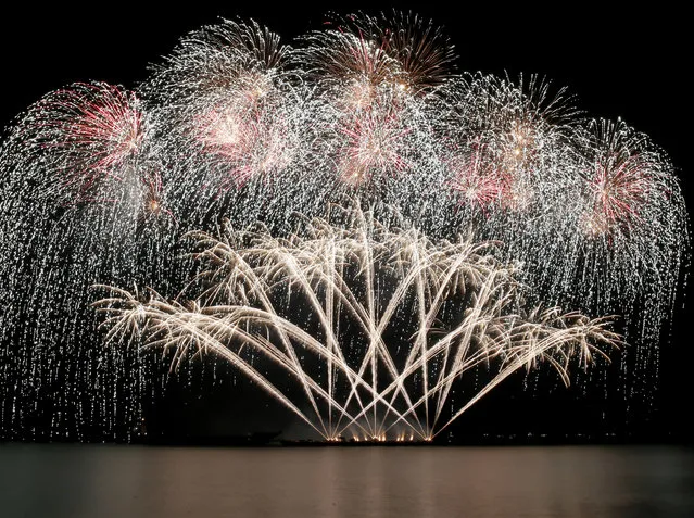 Fireworks from the Italy light up the sky at scenic Manila Bay at the 6th International Pyro musical competition on Valentine's Day Saturday, February 14, 2015 at the Mall of Asia shopping complex at suburban Pasay city south of Manila, Philippines. The fireworks competition, which runs for six consecutive weekends, features entries from 11 countries with Canada winning the championship last year. Aside from the Philippines, other countries competing are the United States, Japan, Brazil, Mexico, The Netherlands, Portugal, Sweden, United Kingdom, Canada and China. (Photo by Bullit Marquez/AP Photo)
