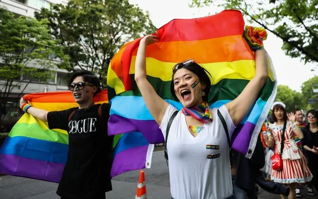Participants walk down the street during the Tokyo Rainbow Pride Parade on April 28, 2019 in Tokyo, Japan. Thousands from the Japanese LGBT community and its supporters are expected to attend the annual Tokyo Rainbow Pride festival on April 28-29 in Yoyogi Park, with the Parade taking place on April 28th. The festival takes place during pride week, which runs through to May 6. (Photo by Takashi Aoyama/Getty Images)