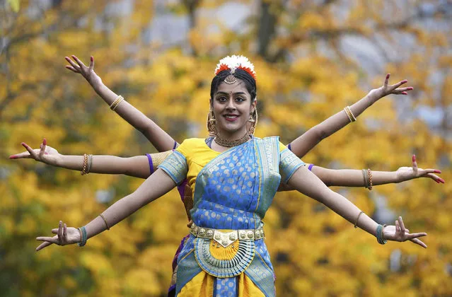 Dancer Maithili Vijayakumar performs on the occasion of the launch of 2021 Diwali celebrations, at St. Andrew Square in Edinburgh, Scotland, Tuesday, November 16, 2021. The multi-cultural celebration will take place for the first time in two years in the center of Edinburgh on Sunday, Nov. 21. (Photo by Andrew Milligan/PA Wire via AP Photo)