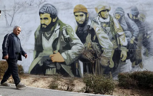 An Iranian man walks past a mural of Iranian revolutionary guard soldiers in a street in Tehran, Iran, 30 January 2024. The US administration has blamed an Iranian-based proxy for a drone attack in Jordan which killed three US soldiers, and the US president vowed for a response over the attack. Iran has denied any involvement in the drone strike on US troops in Jordan. (Photo by Abedin Taherkenareh/EPA/EFE)