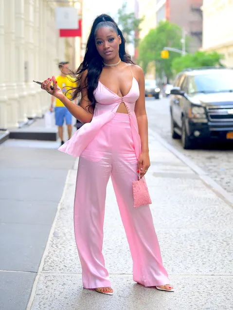 Keke Palmer was spotted shopping in Soho on Wednesday, June 25, 2019, looking stunning in a low cut pink ensemble. She wore a high Ariana Grande style ponytail, as she went braless for the outing. She is currently co-hosting Strahan and Sara, the sequel to Good Morning America, while Sara is on Maternity Leave. (Photo by DIGGZY/Splash News and Pictures)