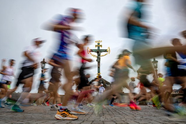 Runners cross the Charles Bridge during the Prague International Marathon in Prague, Czech Republic, 05 May 2024. About 8.000 runners took part in the race. (Photo by Martin Divisek/EPA/EFE)
