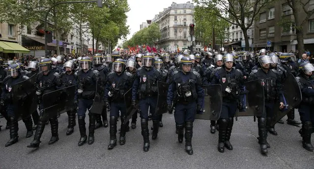 Riot police take up position during a demonstration against French labour law reform in Paris, France, May 12, 2016. (Photo by Gonzalo Fuentes/Reuters)