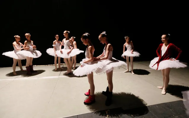 Students prepare for a performance by the graduates at the State Theatre of Opera and Ballet, at the Krasnoyarsk choreographic college in the Siberian city of Krasnoyarsk, Russia, May 4, 2017. (Photo by Ilya Naymushin/Reuters)