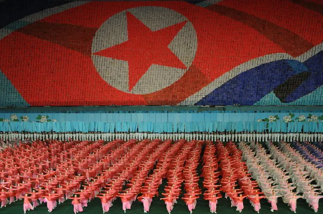 “The Mass Games”. Tens of thousands of performers take part in the Arirang Mass Games held each year in Pyongyang. Each pixel in the backdrop is a schoolchild holding a book of coloured pages, turned on command to display patriotic images telling the history of the nation. Thousands of dancers form the foreground, all moving in perfectly choreographed uniformity. Photo location: May Day Stadium, Pyongyang, Democratic People's Republic of Korea. (Photo and caption by Nicola Chilton/National Geographic Photo Contest)