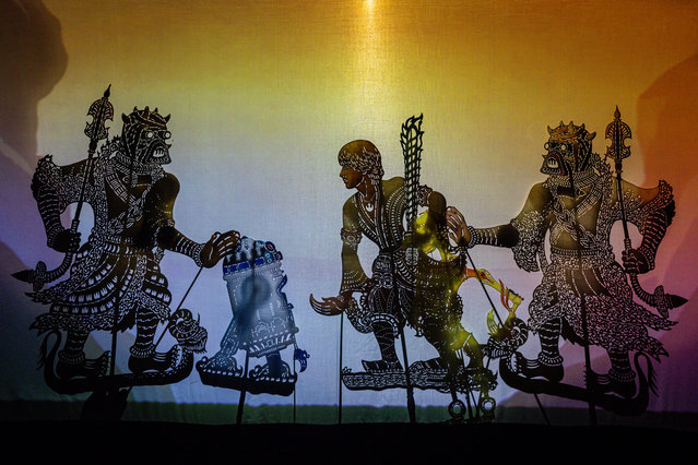 Star Wars characters (from left) Tusken Raider, R2-D2, Luke Skywalker and Tusken Raider seen on the screen during a Star Wars inspired Wayang Kulit, a traditional shadow puppetry performance at the Royal Selangor Visitor Centre, on May 18, 2024 in Kuala Lumpur, Malaysia. “Peperangan Bintang,” known as Star Wars, presented by Fusion Wayang Kulit, is a modern take on wayang kulit aimed at reviving the traditional shadow puppetry art form in Malaysia by merging it with digital multimedia and incorporating science fiction stories and iconic pop culture elements to spread cultural awareness while preserving its roots for new audiences and younger generations. (Photo by Annice Lyn/Getty Images)