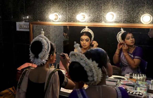 Indian dancers get ready backstage before performing at Naman, a classical dance festival in Bangalore, India, Sunday, August 2, 2015. Various Indian classical dance forms represent the rich cultural heritage of the country. (Photo by Aijaz Rahi/AP Photo)