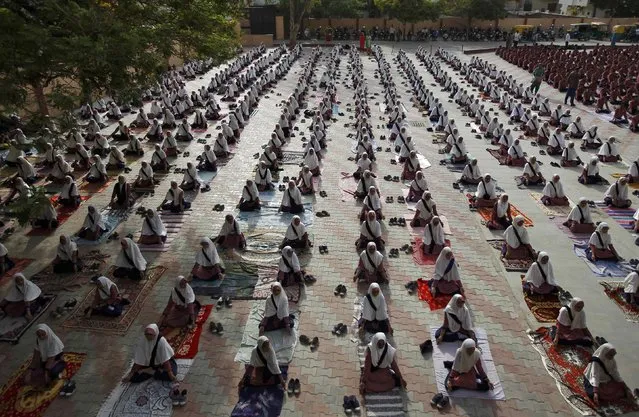 Students practice yoga during a training session ahead of World Yoga Day in Ahmedabad, India, June 16, 2016. (Photo by Amit Dave/Reuters)