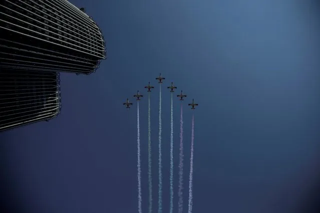 Planes fly during a military parade to mark Spain's National Day in Madrid, Spain, October 12, 2021. (Photo by Javier Barbancho/Reuters)