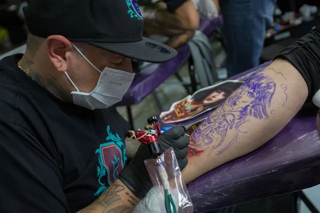 People and tattooists in the 7th “Tattoo Week” in Sao Paulo on July 14, 2017, considered the world's largest gathering of tattoo artists with 575 exhibitors and 3,400 artists from around the world. (Photo by Paulo Lopes via ZUMA Wire)