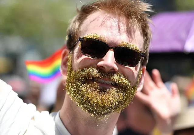 A man with a glitter beard marches along the San Francisco Pride parade route in San Francisco, California on Sunday, June, 26, 2016. (Photo by Josh Edelson/AFP Photo)