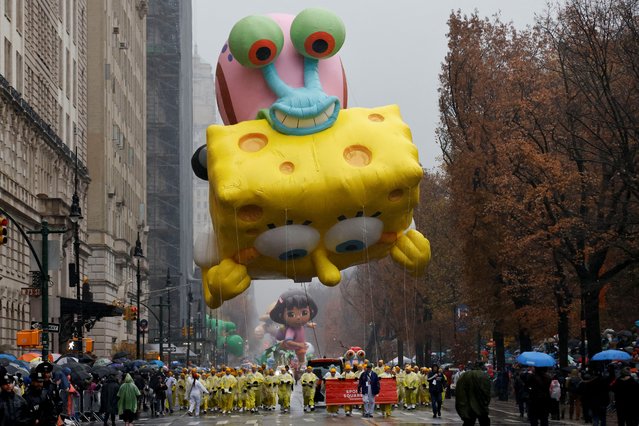 The SpongeBob SquarePants & Gary balloon flies during the 98th Macy's Thanksgiving Day Parade in New York City on November 28, 2024. (Photo by Eduardo Munoz/Reuters)