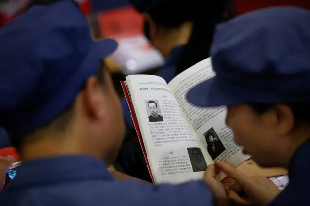 Participants read a textbook during a history lesson at the Red Culture Training Centre during a Communist team-building course extolling the spirit of the Long March in Jinggangshan, Jiangxi province, China, September 14, 2017. (Photo by Thomas Peter/Reuters)