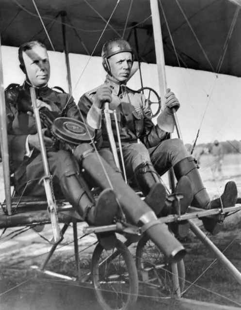 Capt. C.D. Chandler handles a machine gun, while Lt. Roy T. Kirtland is at the controls of the plane in in College Park, Maryland on June 7, 1912. It is the first time a machine gun is carried on a plane. (Photo by AP Photo)