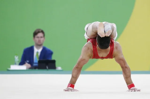 2016 Rio Olympics, Artistic Gymnastics, Preliminary, Men's Qualification, Subdivisions, Rio Olympic Arena, Rio de Janeiro, Brazil on August 6, 2016. Oliver Hegi (SUI) of Switzerland competes on the floor. (Photo by Athit Perawongmetha/Reuters)