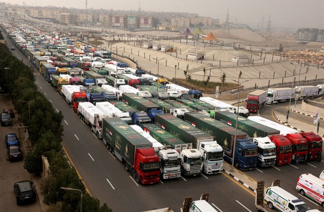 Trucks carrying Egyptian humanitarian aid wait to start moving to the Rafah border crossing to enter Gaza, amid a ceasefire between Israel and Hamas, in Cairo, Egypt, on January 26, 2025. (Photo by Mohamed Abd El Ghany/Reuters)