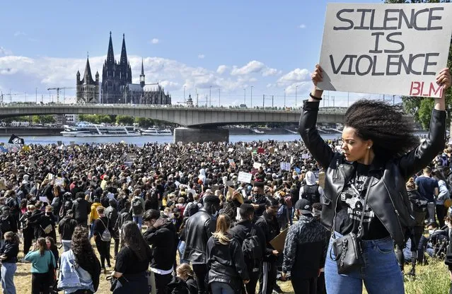 Thousands of people demonstrate in Cologne, Germany, Saturday June 6, 2020, to protest against racism and the recent killing of George Floyd by police officers in Minneapolis, USA. His death has led to Black Lives Matter protests in many countries and across the US. A US police officer has been charged with the death of George Floyd. (Photo by Martin Meissner/AP Photo)