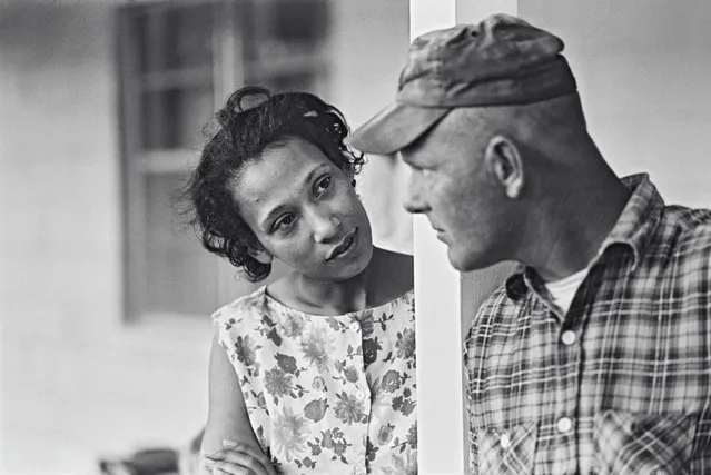 Mildred and Richard Loving, pictured on their front porch in King and Queen County, Virginia, in 1965. In June 1958, the couple went to Washington DC to marry, to work around Virginia’s Racial Integrity Act of 1924, which made marriage between whites and non-whites a crime. After an anonymous tip, police officers raided their home a month later, telling the Lovings their marriage certificate was invalid. In 1959, the Lovings pled guilty to “cohabiting as man and wife, against the peace and dignity of the Commonwealth”. (Photo by Grey Villet/The Guardian)