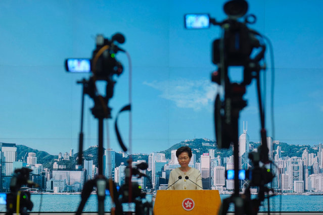Hong Kong Chief Executive Carrie Lam listens to reporters' questions during a press conference in Hong Kong, Tuesday, July 7, 2020. TikTok said Tuesday it will stop operations in Hong Kong, joining other social media companies in warily eyeing ramifications of a sweeping national security law that took effect last week. (Photo by Vincent Yu/AP Photo)