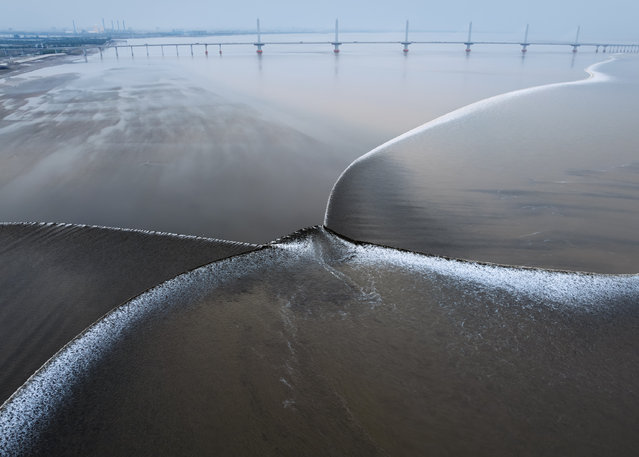 Aerial view of butterfly-shaped tide in Qiantang River on April 16, 2025 in Jiaxing, Zhejiang Province of China. (Photo by Qian Weizhong/VCG via Getty Images)