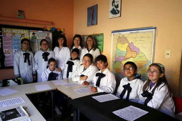 Laura Paipo (top row right), first blind principal in Uruguay poses with students and co-workers at special school 279 in Montevideo, September 18, 2015. (Photo by Andres Stapff/Reuters)